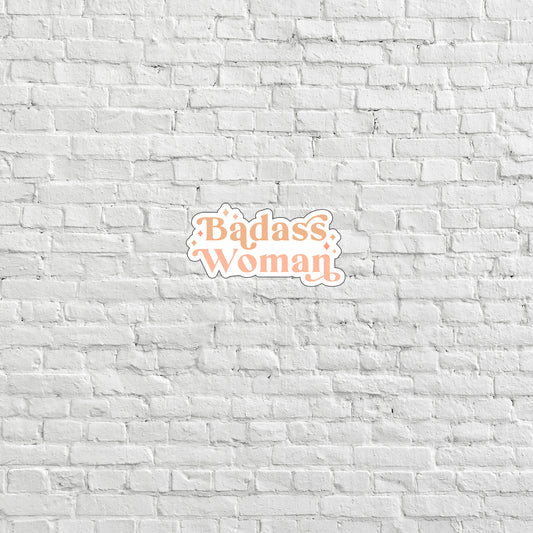 a brick wall with the words badass woman on it