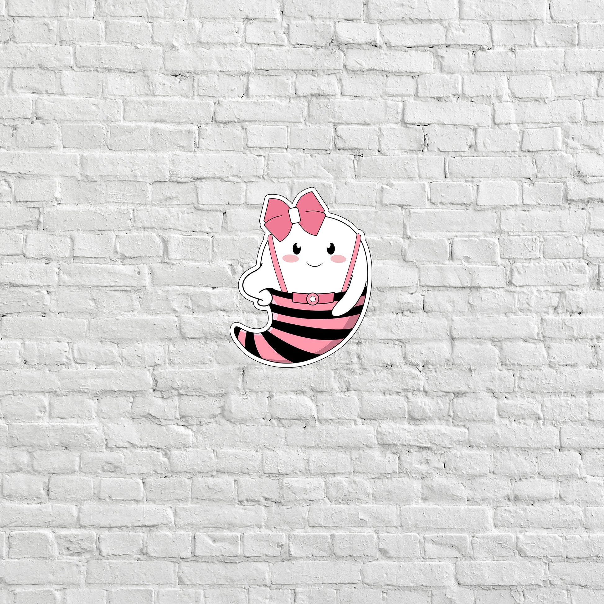 a white brick wall with a cartoon character on it