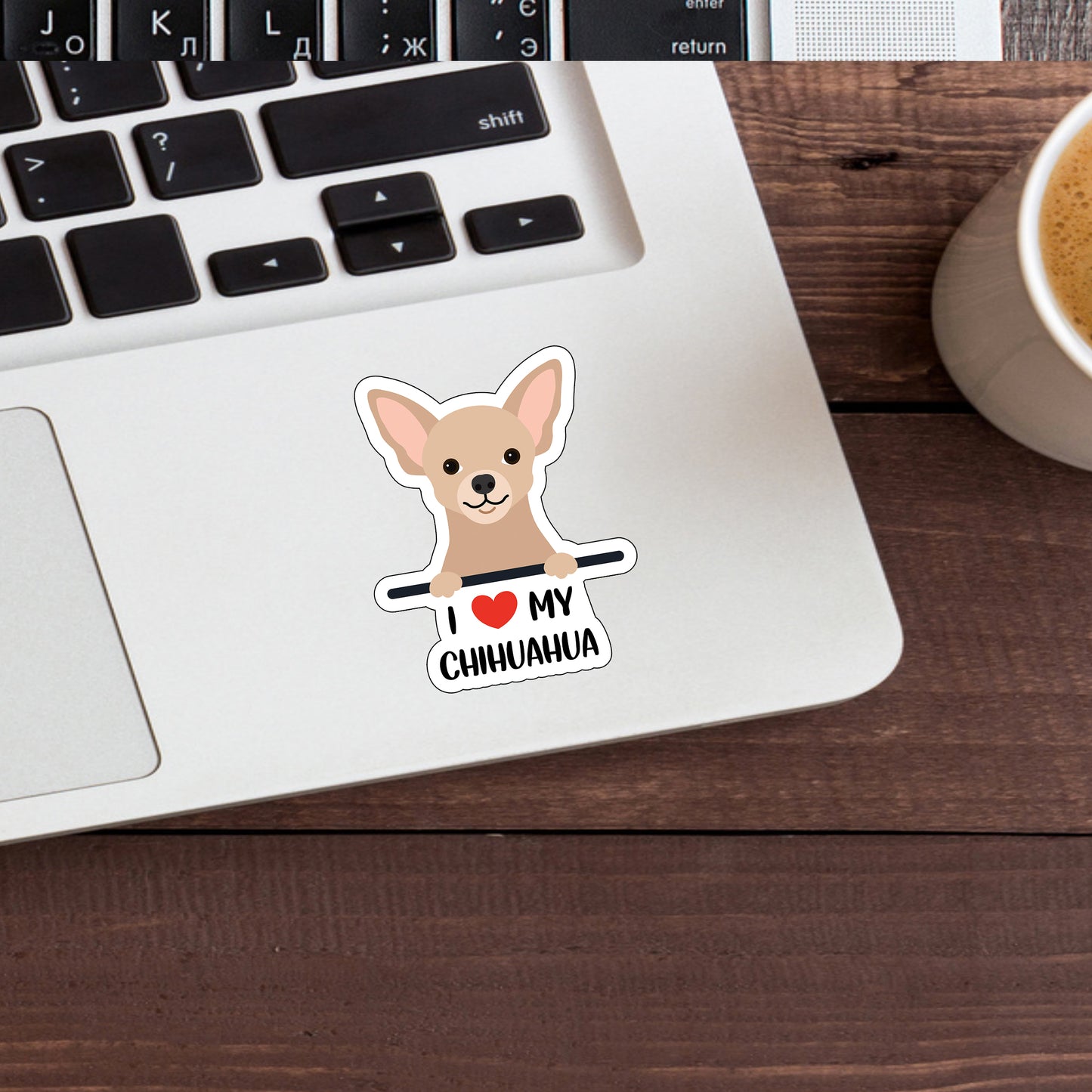 a laptop with a sticker of a chihuahua on it