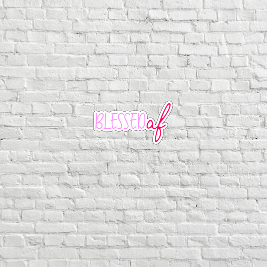 a white brick wall with a pink lettering on it