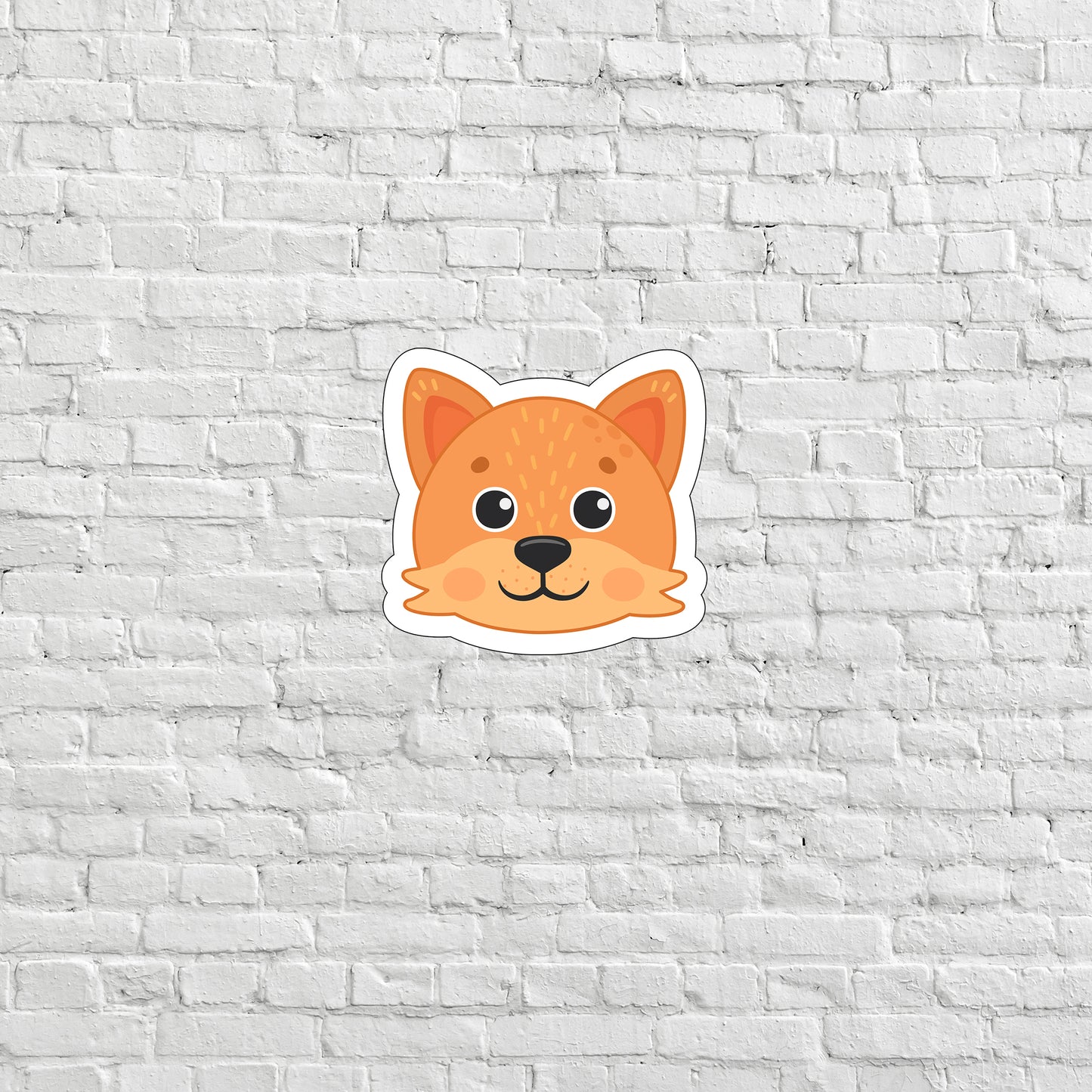 a sticker of a dog's face on a white brick wall