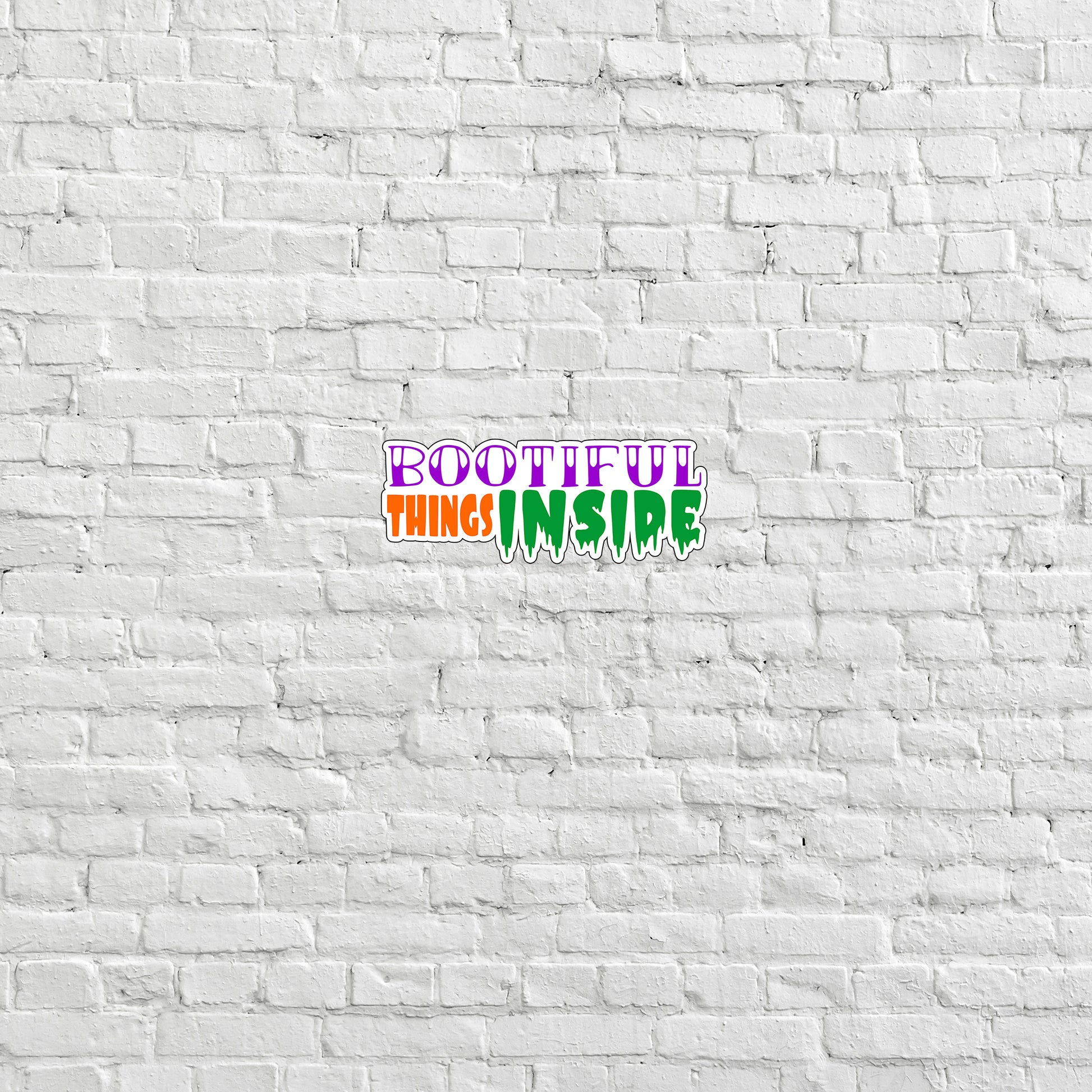 a white brick wall with a colorful word on it