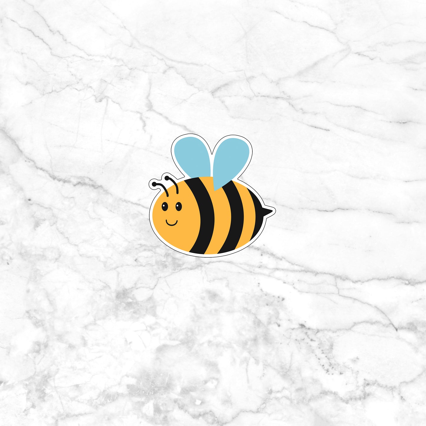 a sticker of a bee on a marble background