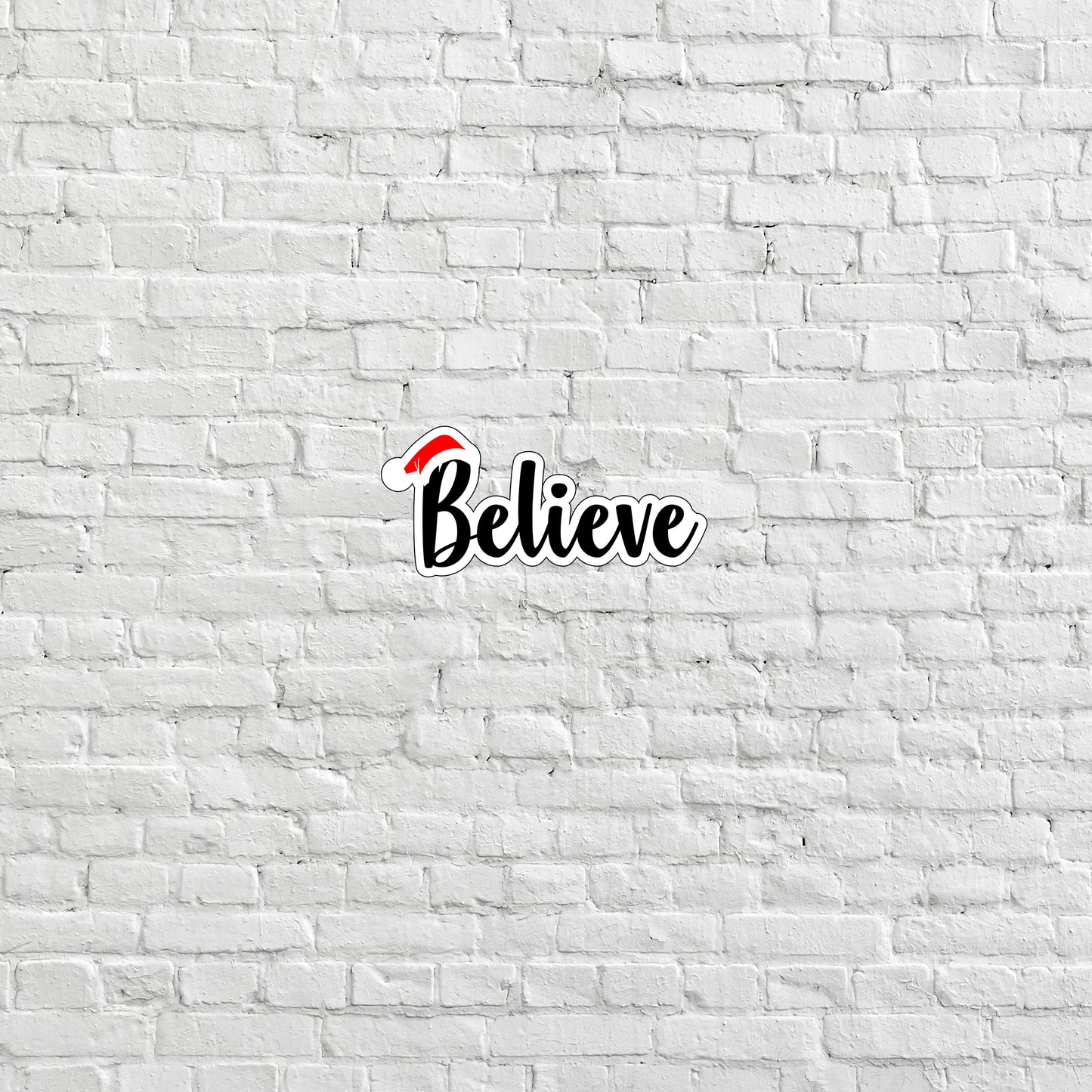 a white brick wall with the word believe painted on it