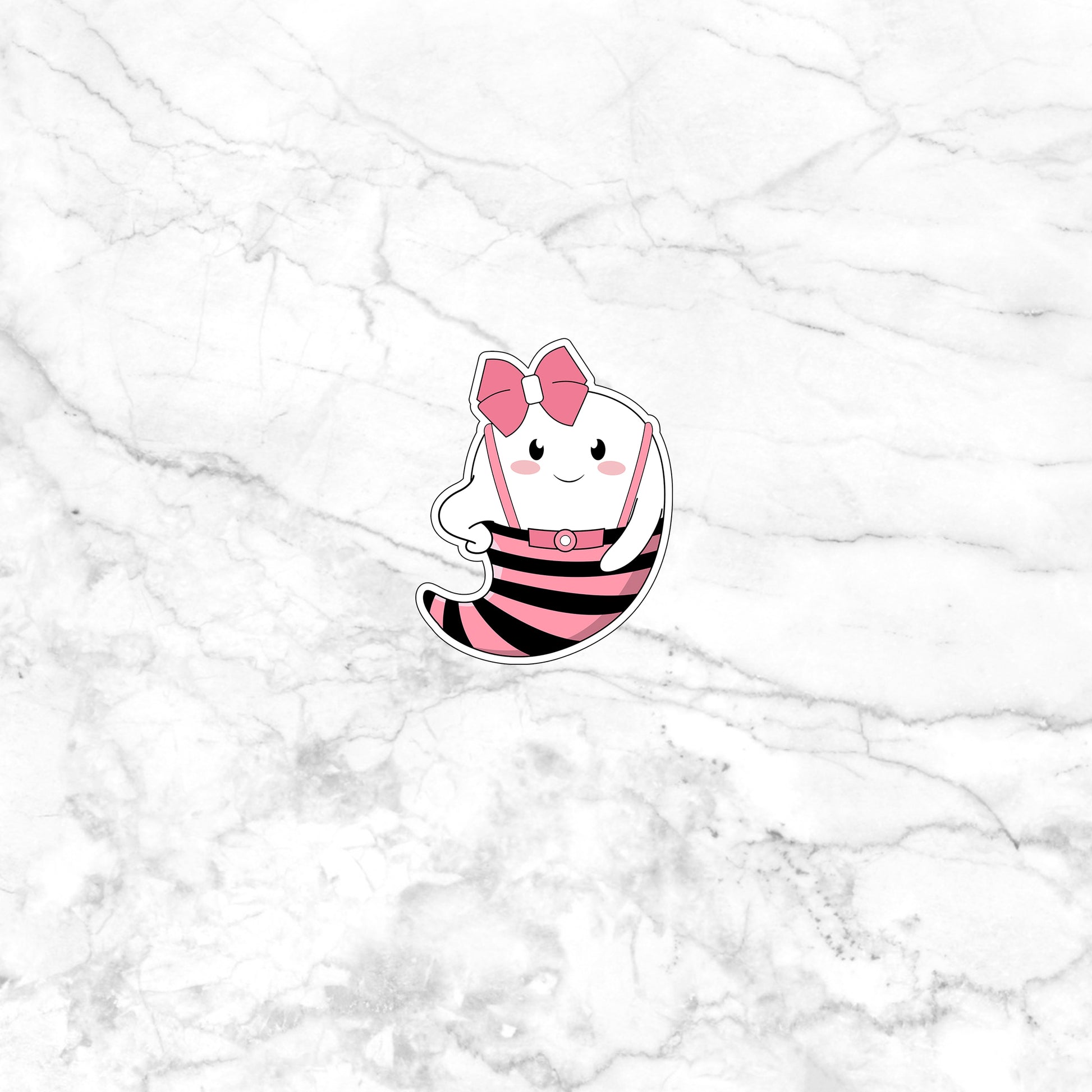 a white marble wall with a pink and black cat sticker on it