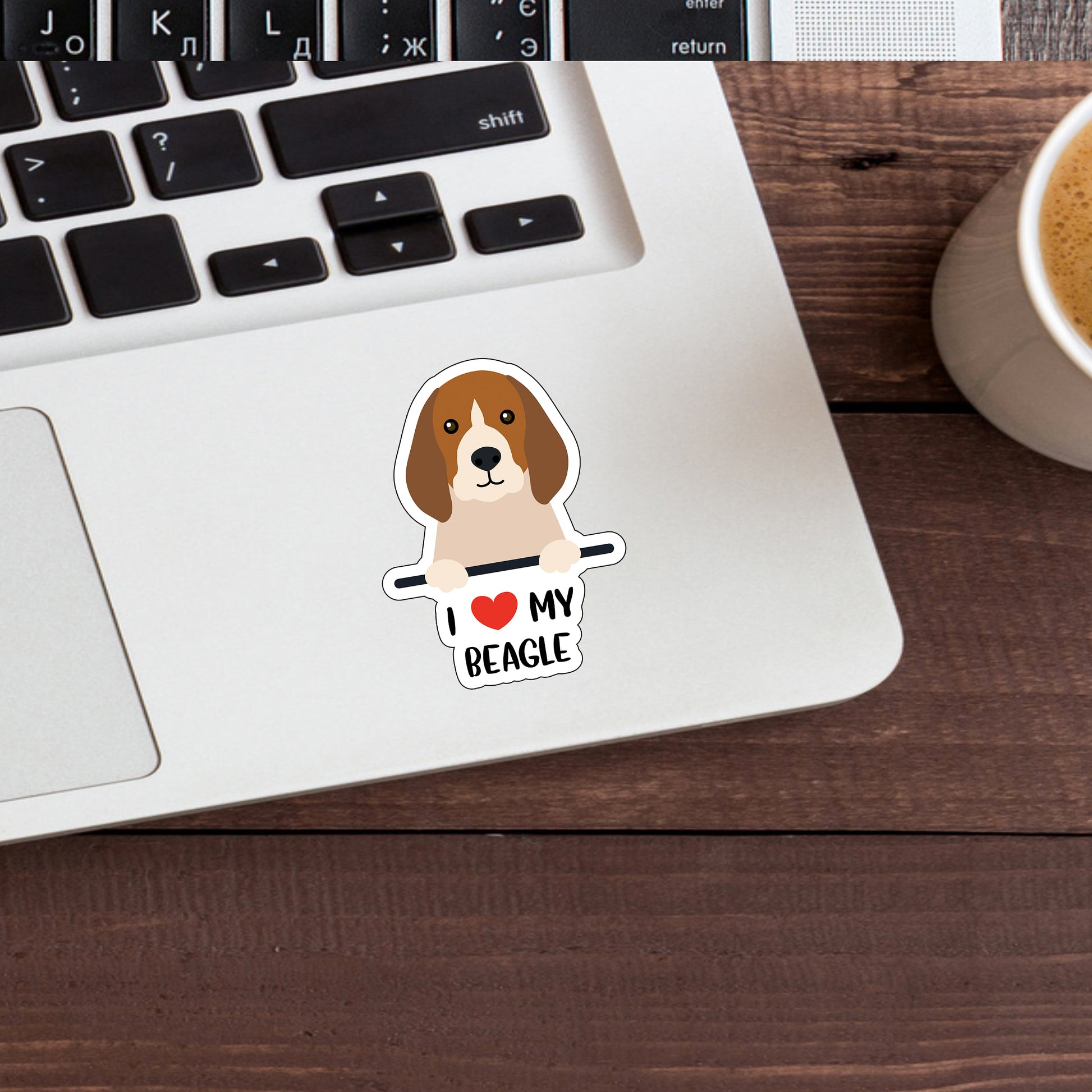 a laptop with a sticker of a dog on it