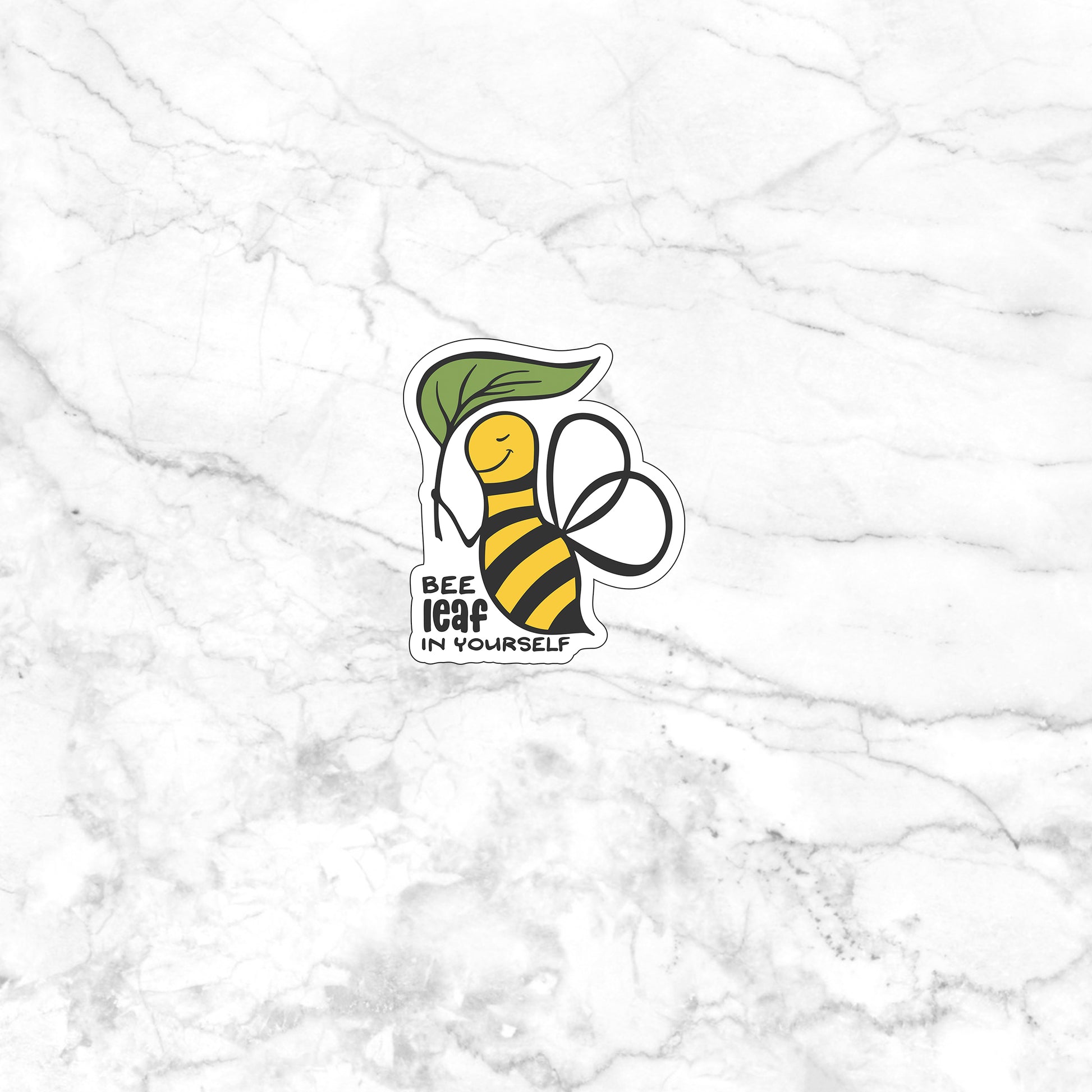 a sticker of a bee on a marble surface