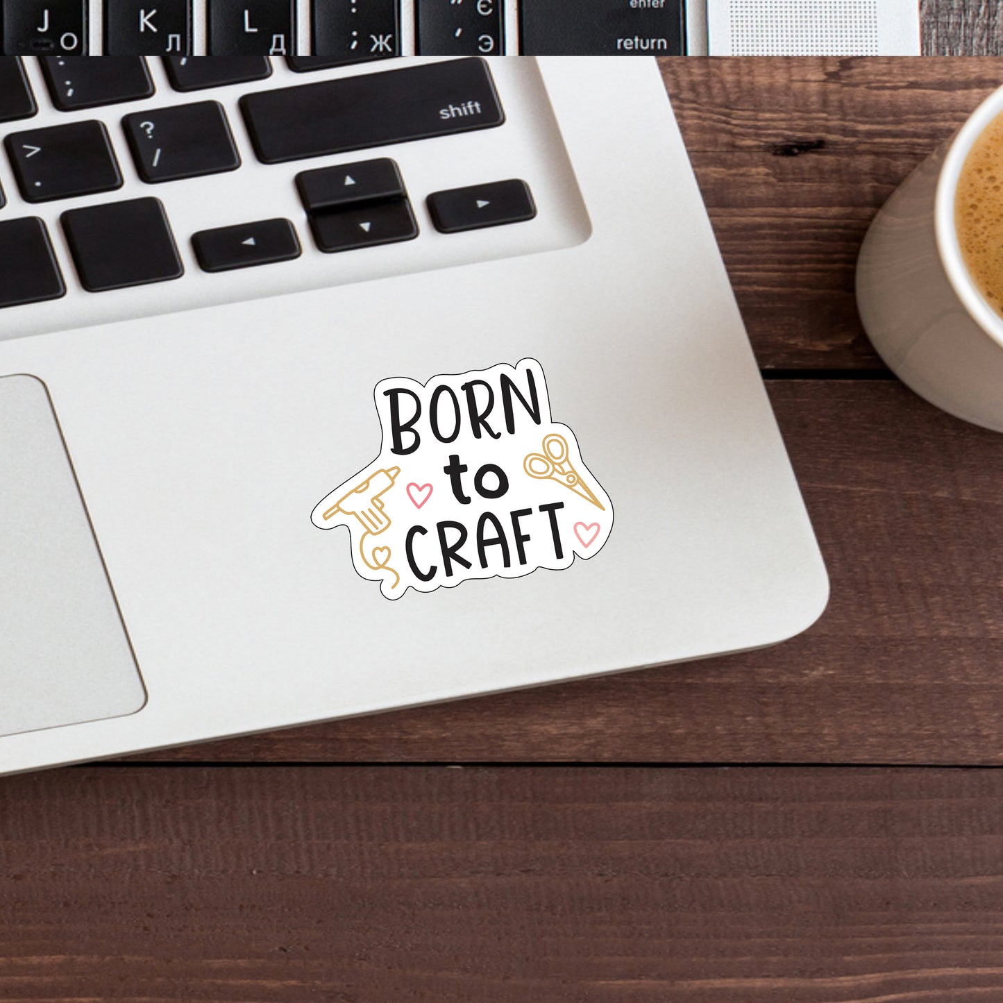 a sticker that says born to craft next to a cup of coffee