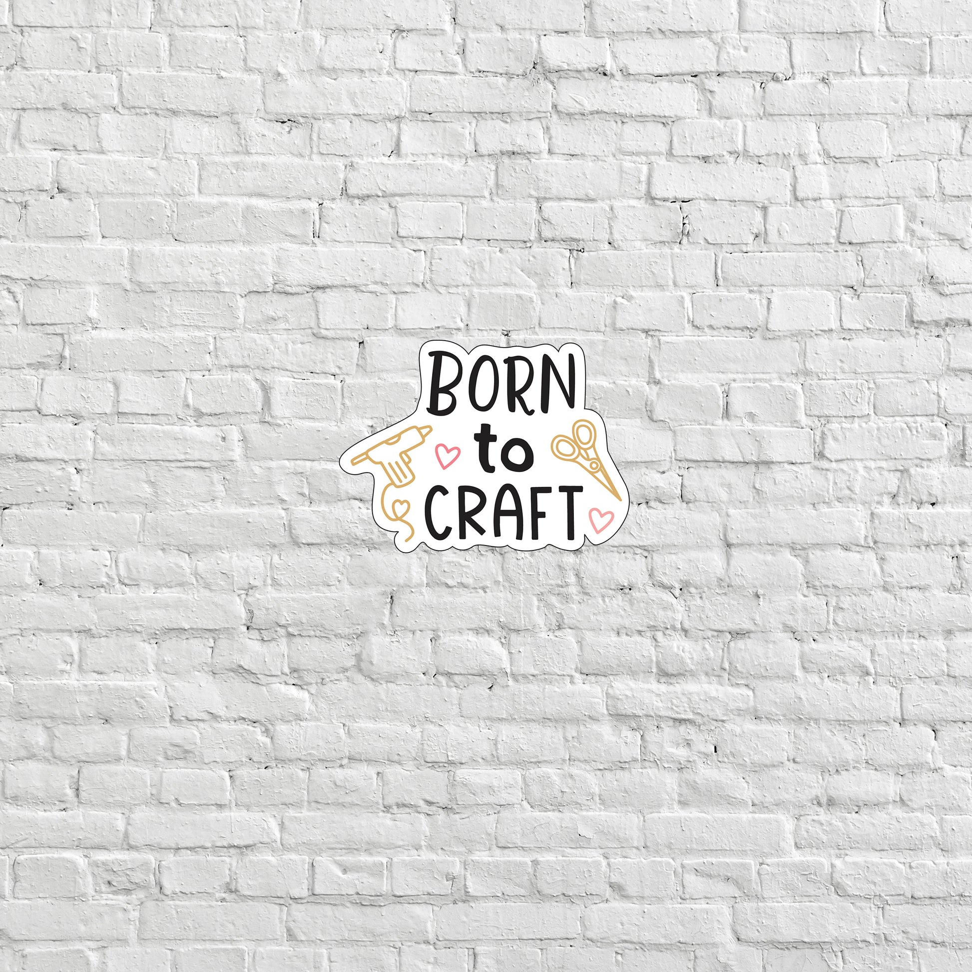 a white brick wall with a sign that says born to craft