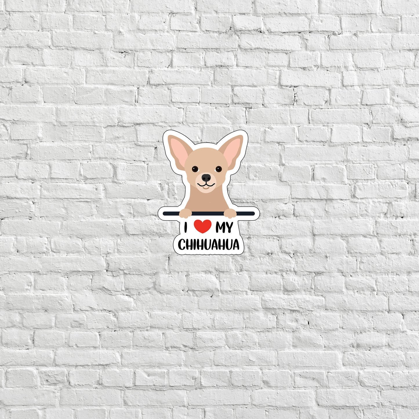 a white brick wall with a chihuahua sticker on it