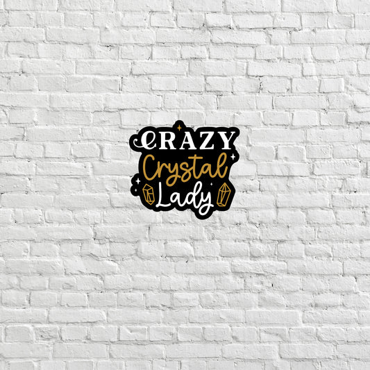 a white brick wall with the words crazy crystal lady on it