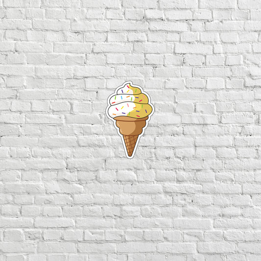 a sticker of a ice cream cone on a white brick wall