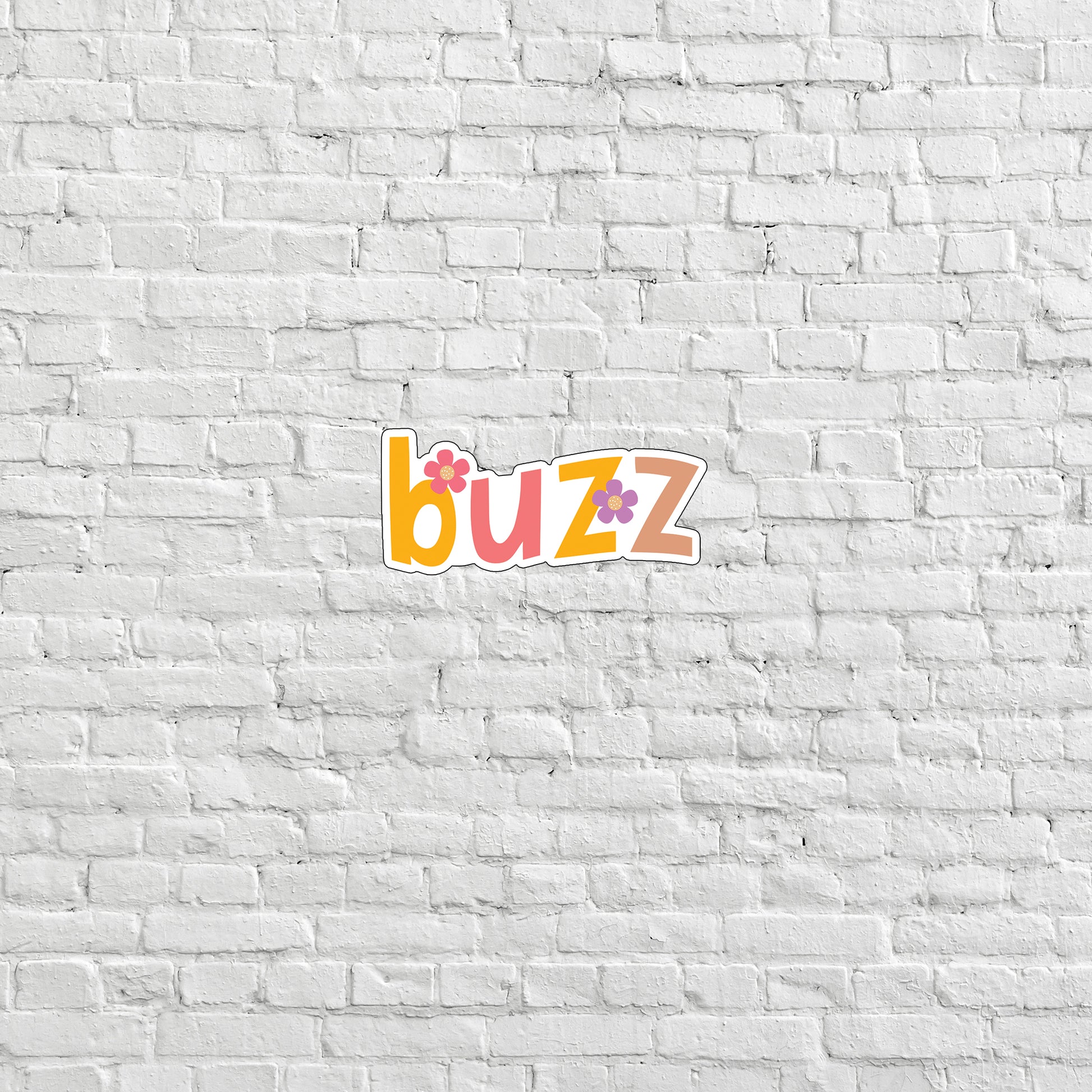 a white brick wall with the word buzz on it