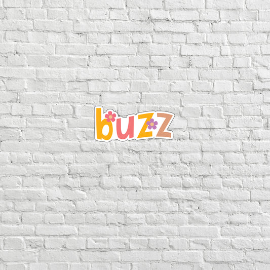 a white brick wall with the word buzz on it