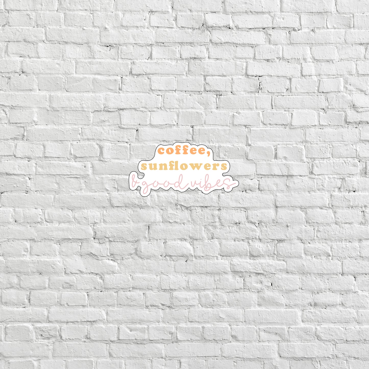 a white brick wall with a coffee sunflower logo on it