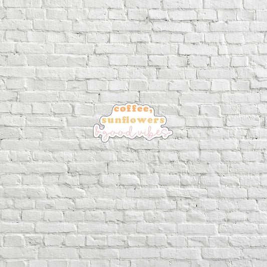 a white brick wall with a coffee sunflower logo on it