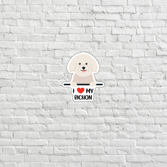 a white brick wall with a sticker of a dog on it