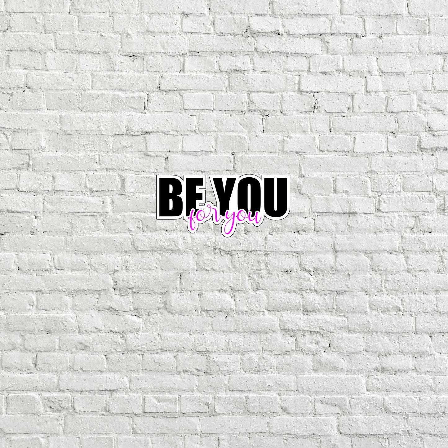 a white brick wall with the words be you on it